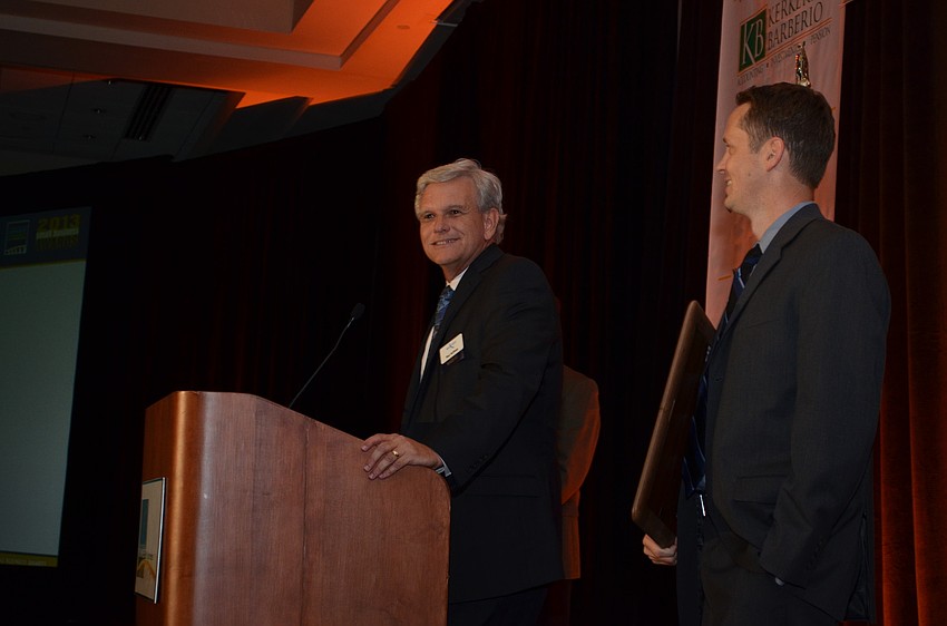 Paul Hoffman of SouthTech basks in the spotlight after winning the Small Business of the Year Award.