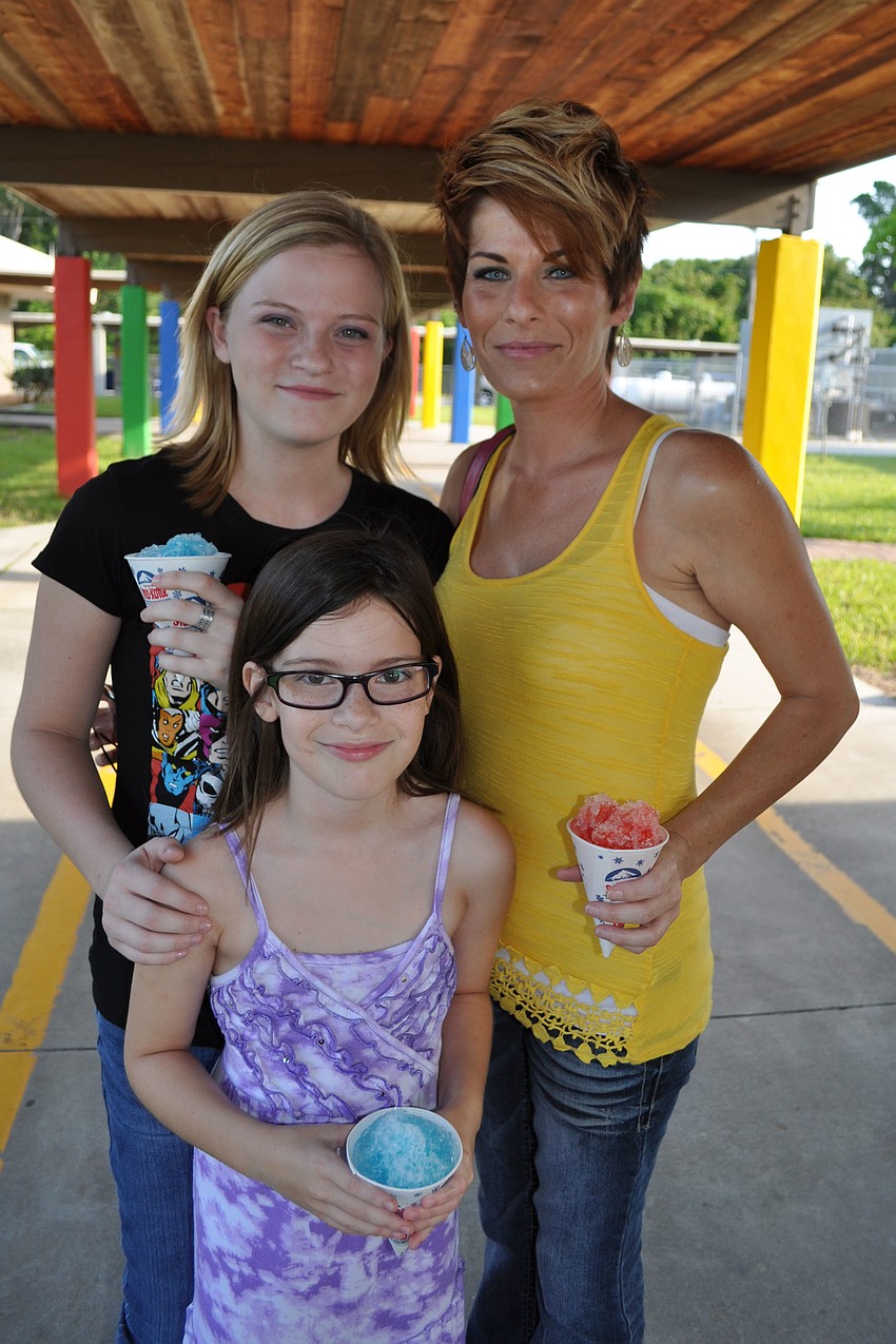 Kelley Ketron, front, enjoyed sno-cones with her sister, Libby, and mom, Sarah.