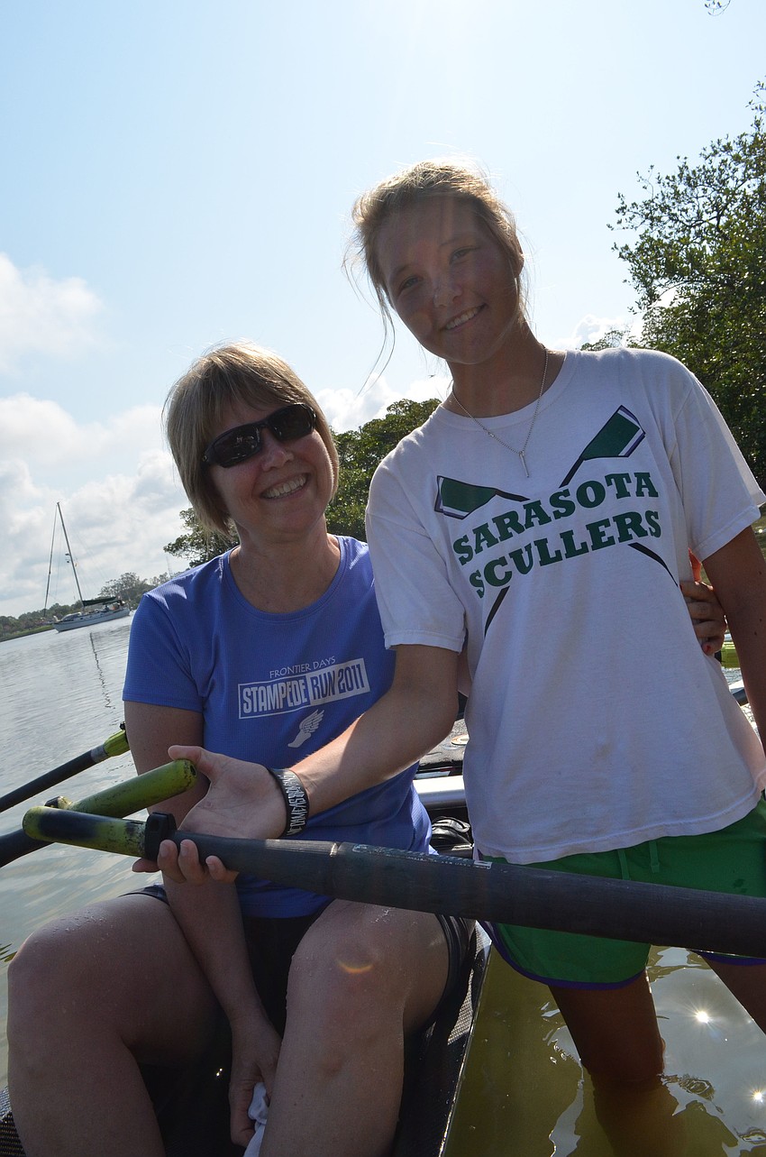 Lily Nelson teaches her aunt Barb Smith how to row.