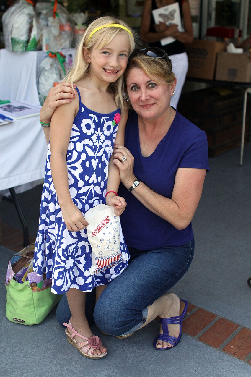 Katie Armstrong, 7, with her mother, Lori, had fun wandering around the store at The Centre Shops on Longboat Key.