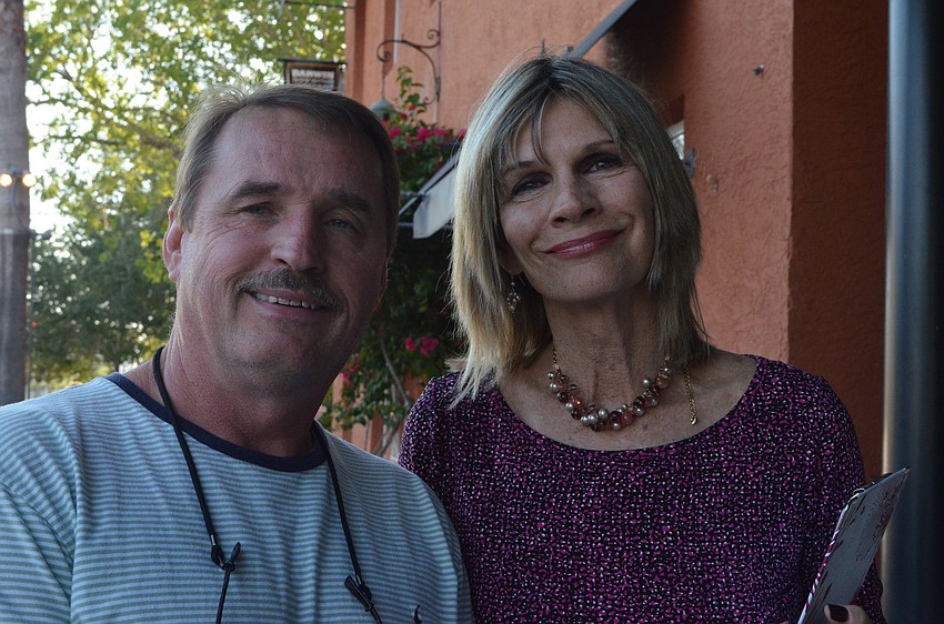 Coâ€“owner of Blue Rooster Devin Rutkowski and Mayor Suzanne Atwell