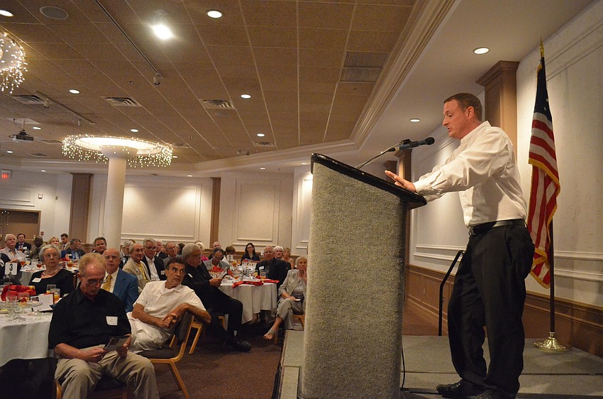 Veteran of Dessert Shield and Dessert Storm Christopher Reynolds calls up veteran John W. Saputo to accept his award.