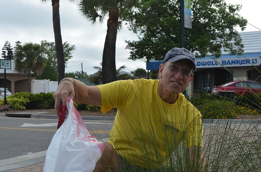 Bill Irish moved to Sarasota from the Baltimore area almost two years ago. He helped pick up trash in Siesta Key Village on Saturday morning.