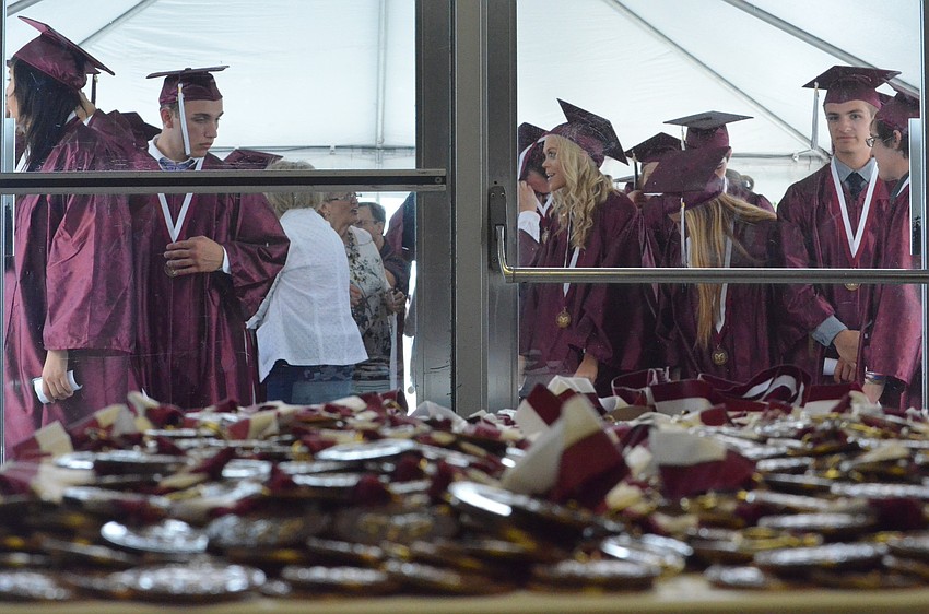Students anxiously wait their turn to cross the stage.