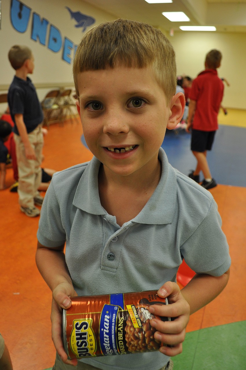 Levi Pellieter, 6, plays a kick-the-can game.