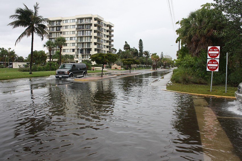 Rain from Tropical Storm Andrea floods Beach Road near the intersection with Beach Way.