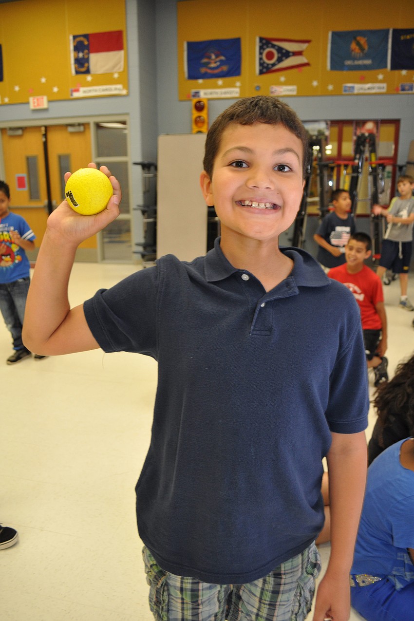 Nolan Carpenter, 9, retrieves a ball for 