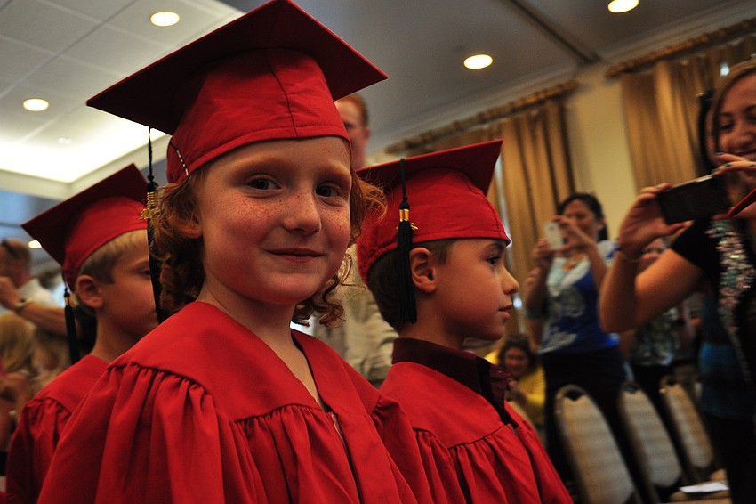 Lilly Robertson marches in with fellow graduates.
