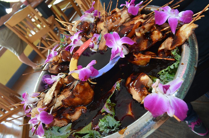 Business members enjoyed chicken teriyaki appetizers at the Daiquiri Deck.