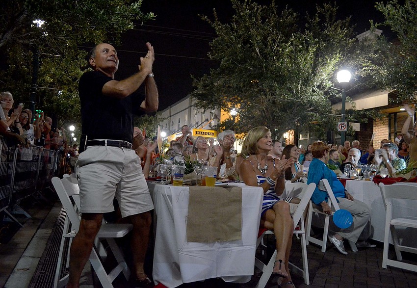 The crowd cheers as Wallenda completes his walk.
