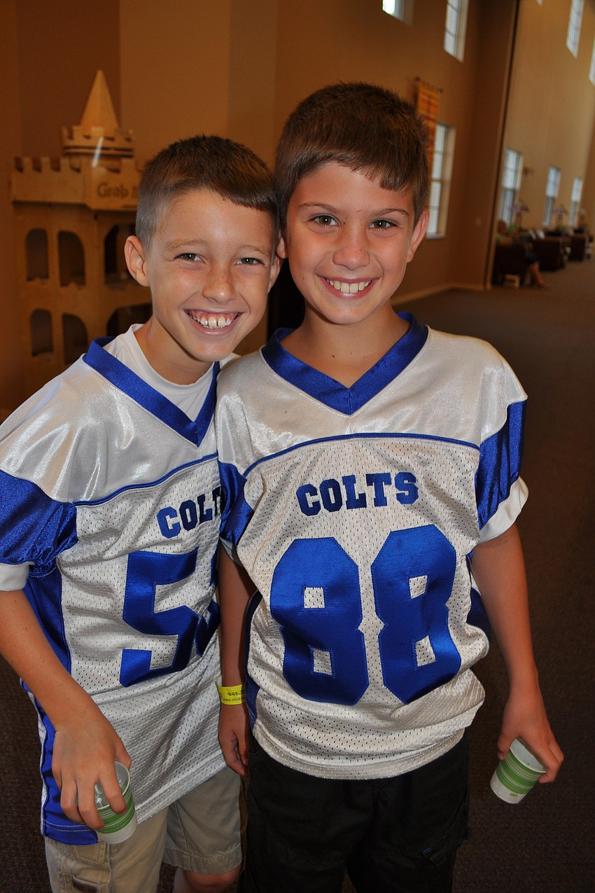 Tyler Perkins, 9, and Jack Lay, 10, sport their Lakewood Ranch Colts team jerseys.