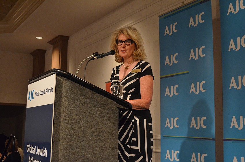 Regional Board President Anne Virag introduces speaker Rabbi Andy Baker. Virag flew in from Buffalo, New York for the talk.