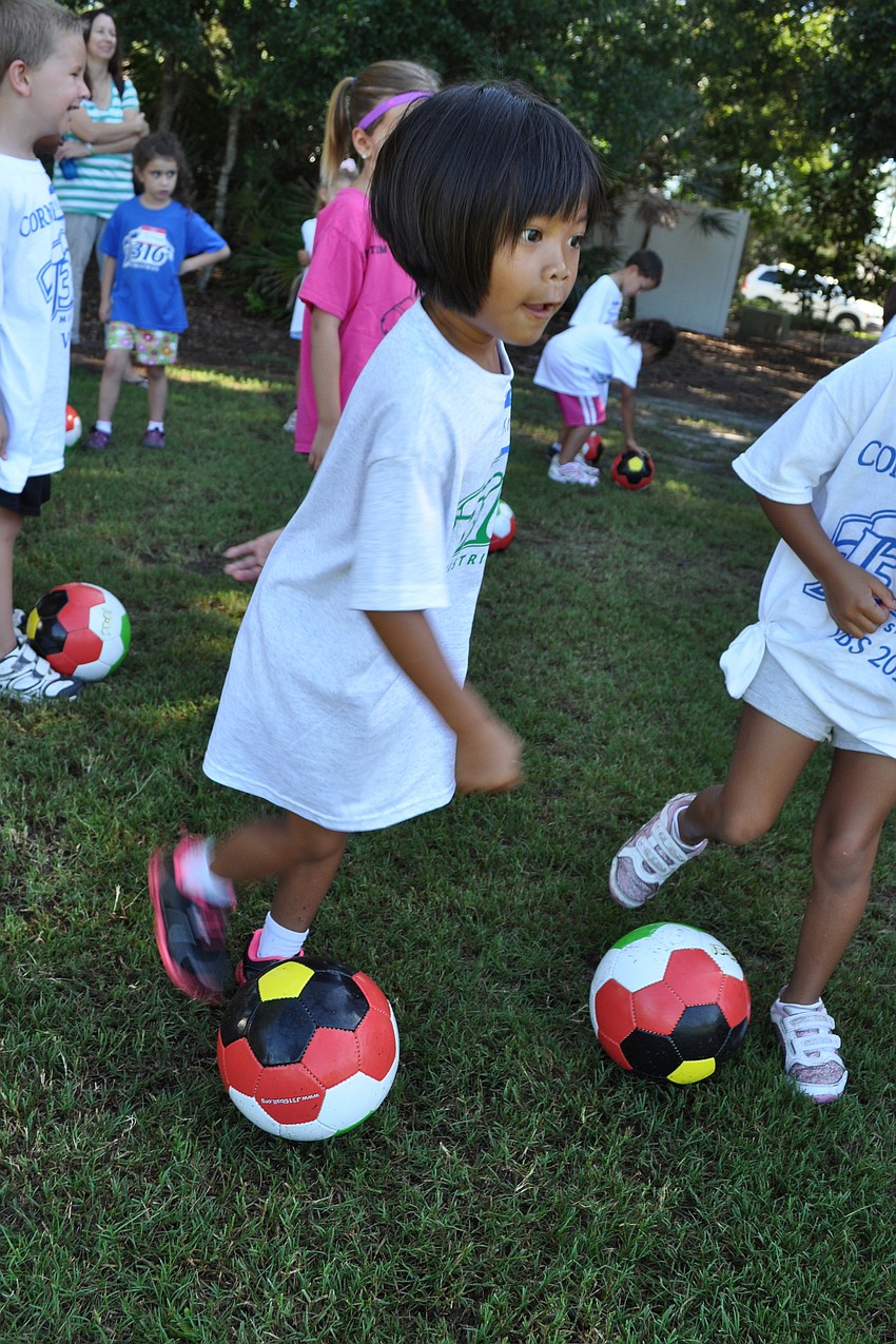 Five-year-old Kara Shumway takes the field for soccer practice.