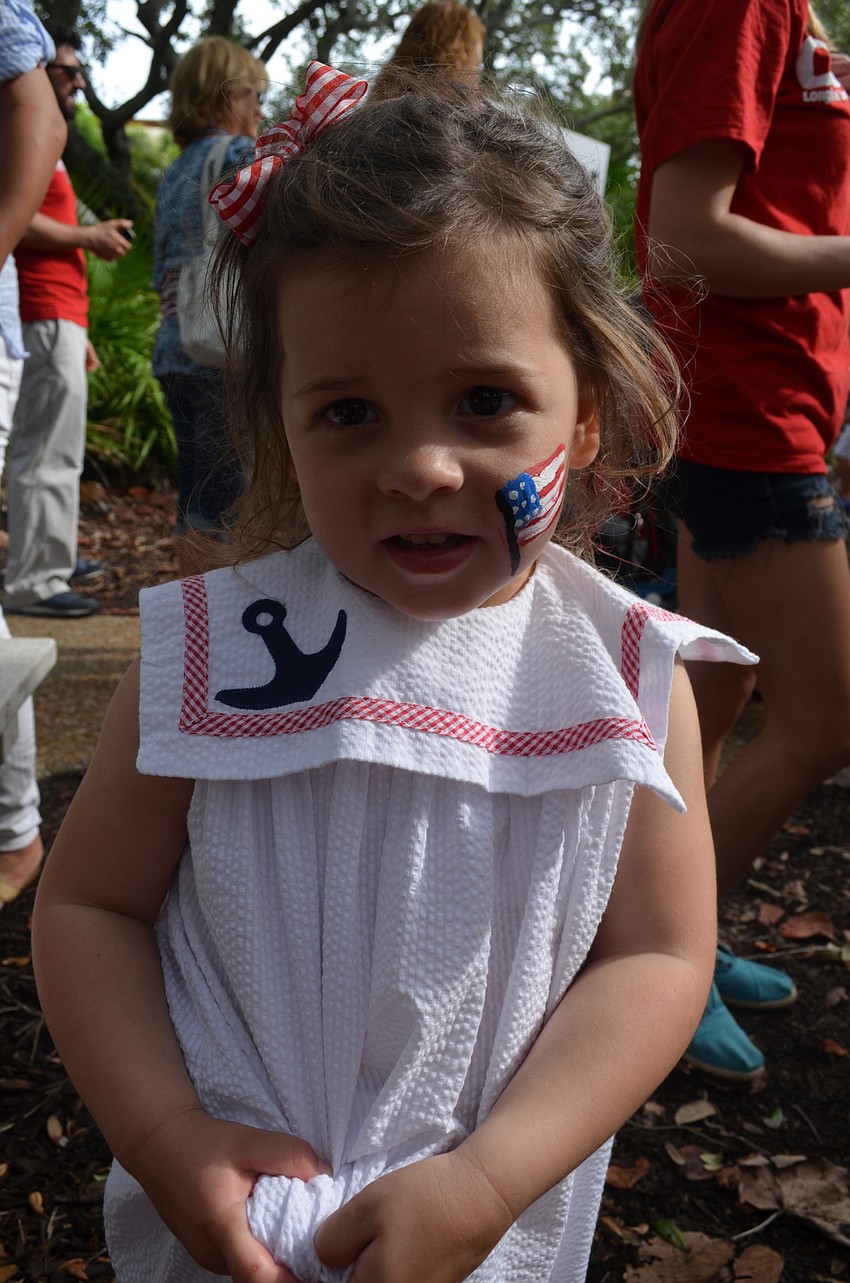 Maeven Helms, 3, gets her face painted at Freedom Fest.