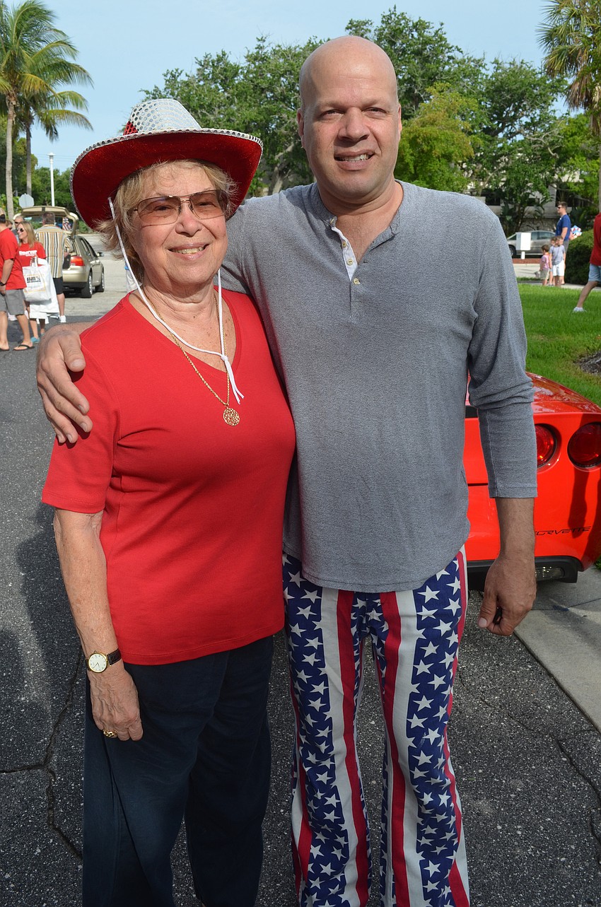 Longboat Key Commissioner Pat Zunz and her son Ivan Zunz participate in the parade. Ivan Zunz says he got his patriotic bellbottoms in California.