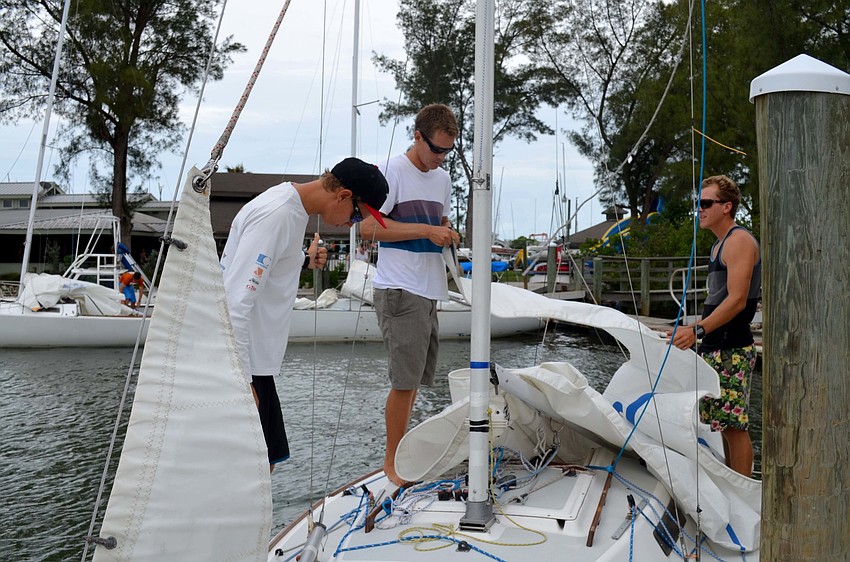 Sailors prepare their boats.