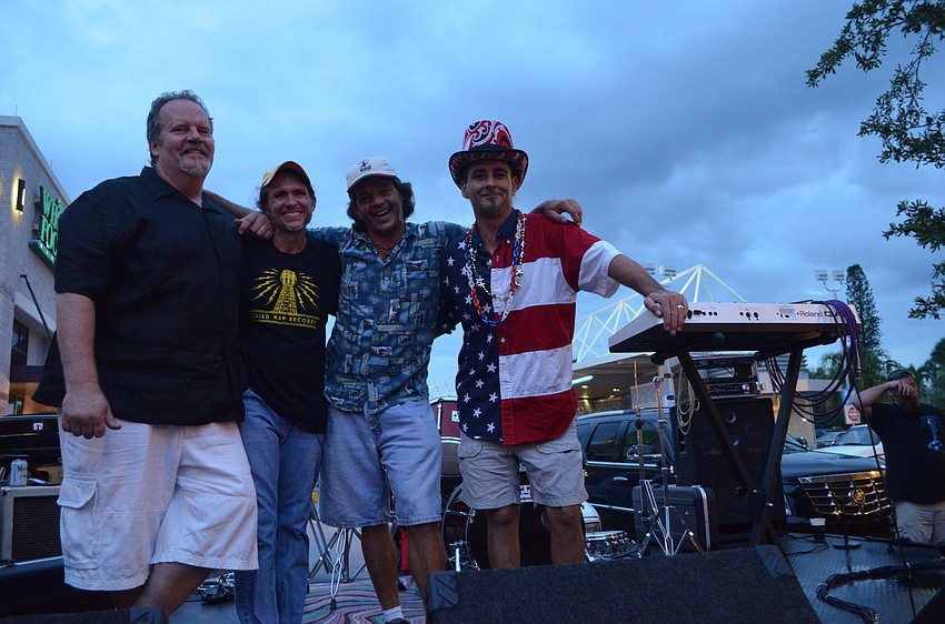 Soul Purpose band members Al Dwen, Mikey Silbaughm Joe Freed and Pat Monahan perform their reggae and rock jams at the block party after the parade.