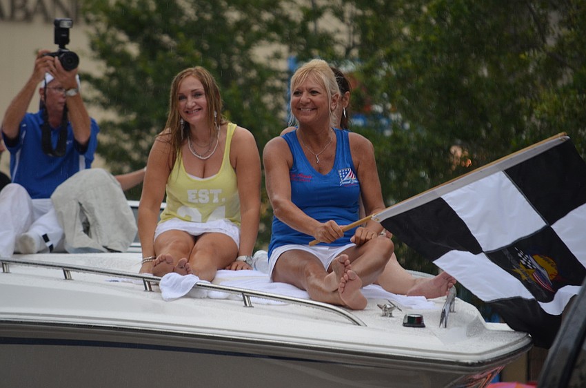 Suncoast Grand Prix Festival Organizer Lucy Nicandri and her team wave to spectators.