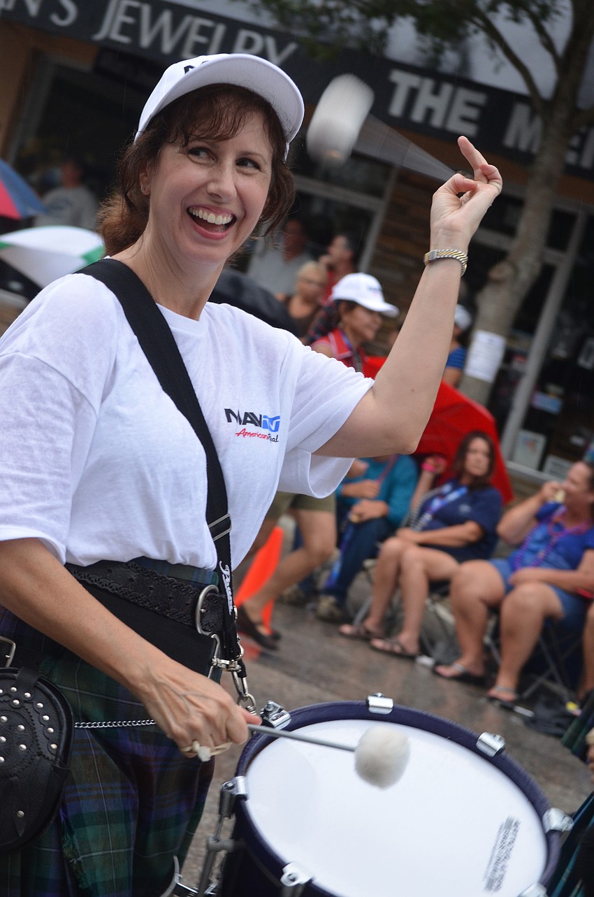 The City of Sarasota Pipe Band members play and march in the parade.