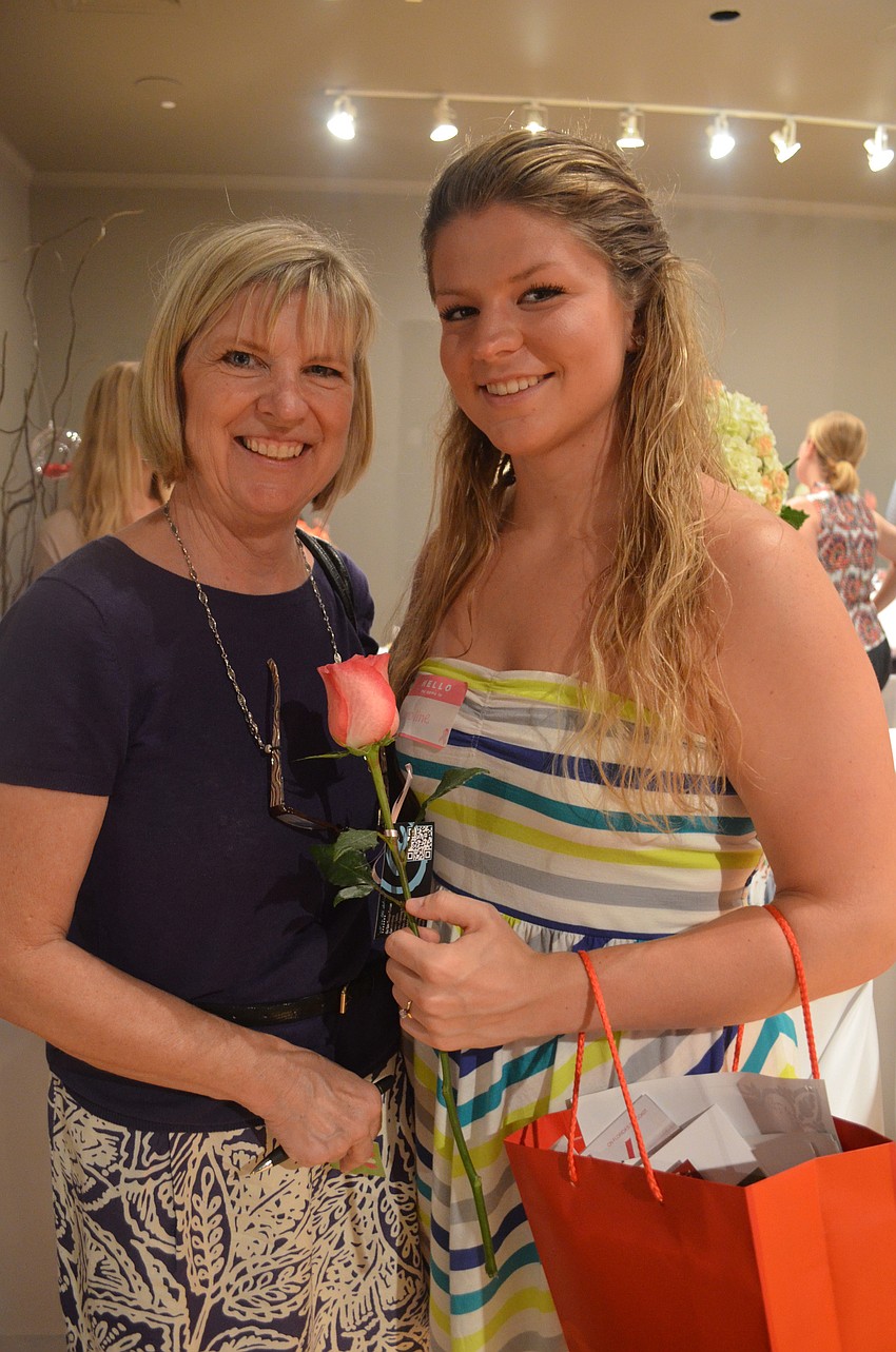 Bridesmaid Stephanie Watkins laces up bride-to-be Caroline Franco. Franco will be married Sept 6, 2014.