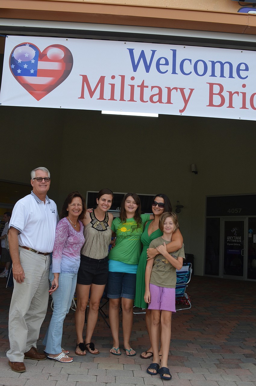 Charlie and Peggy Weniger came to help their daughter Lt. Kari Weniger of the Navy find a wedding dress. Cousins Chloe, Bryn and Amelia Austin also helped. Weniger met her fiancÃ©, who is also in the Navy, in Bahrain.