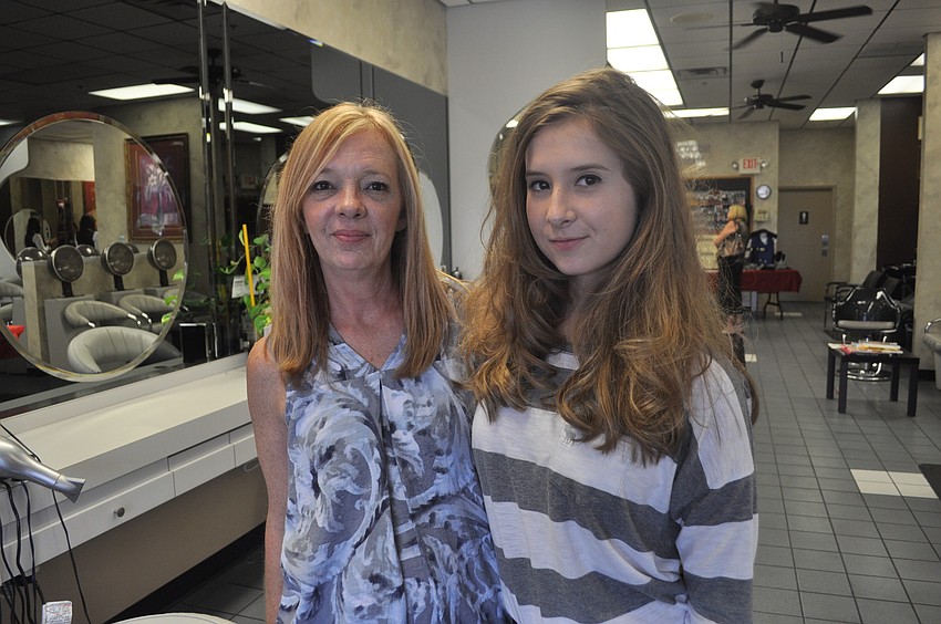 Loretta Duffy with her daughter, Caitlyn, who got her hair curled.