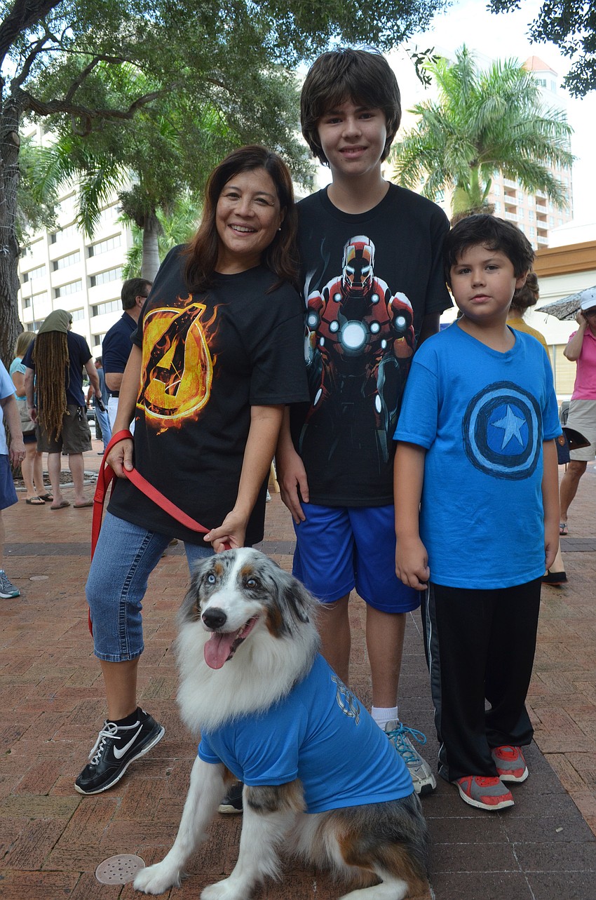 Angela Hartvigsen and her sons Ben, 12, and Will, 8, and their Australian shepherd dress as the Avengers.