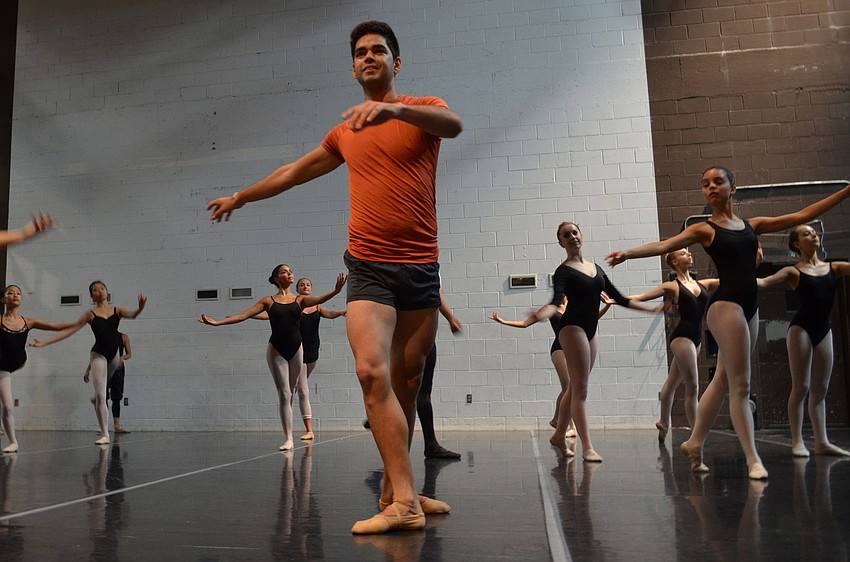 Edward Gonzalez, a new company member of Sarasota Ballet, makes his debut helping the Summer Intensive students in class