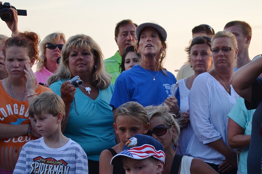 Cyndi Seamon talks to the crowd about sea turtles and the nest opening.