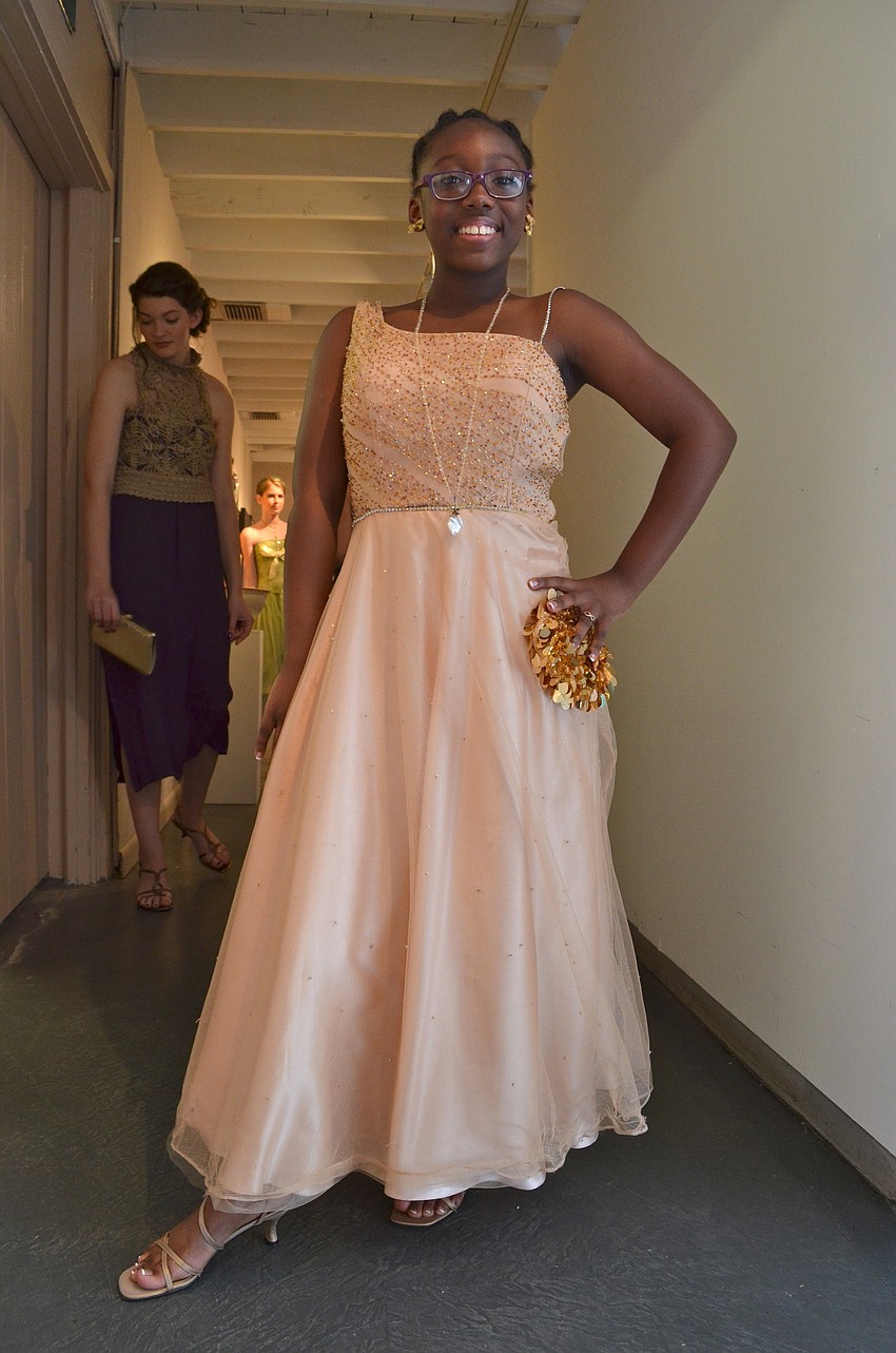 Zeneya Matthews poses in a dress designed by Antonia Davis who won the accolade for biggest passion