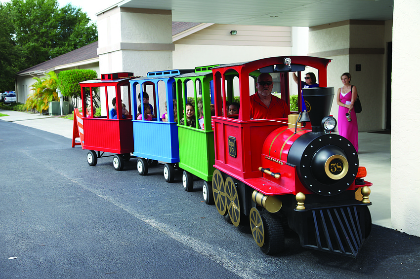 All of the children look forward to their train ride around the parking lot.