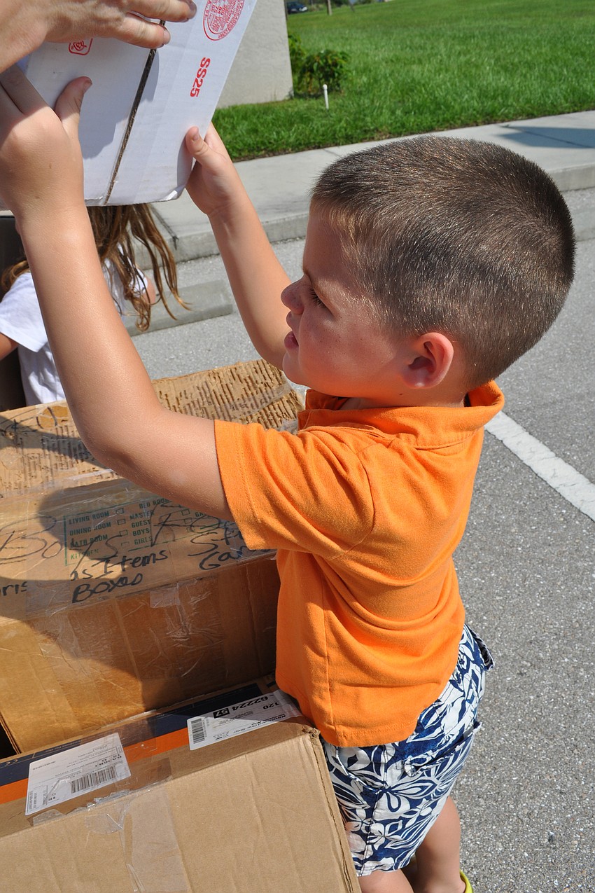 Caleb Buchanan, 4, rebuilds the wall of Jericho.