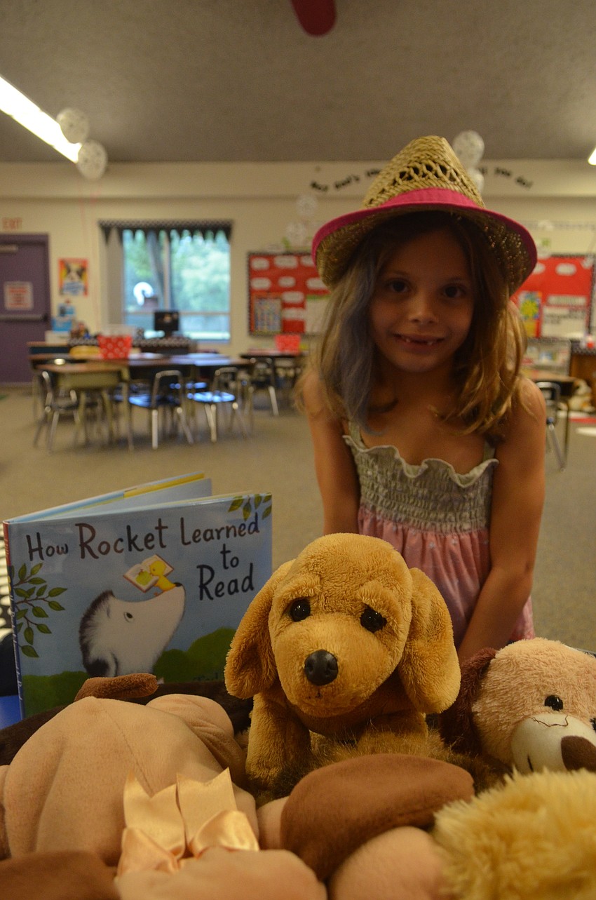 Alexa Rouen, 7, meets her new second grade teacher.