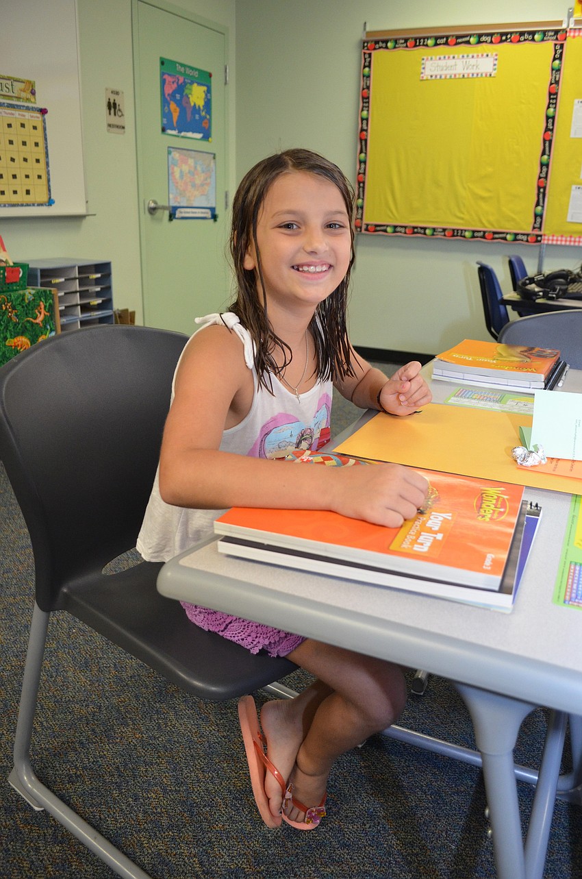 Macy Meshad sits at her new desk in Ms. Ehrenhaftâ€™s third-grade class.