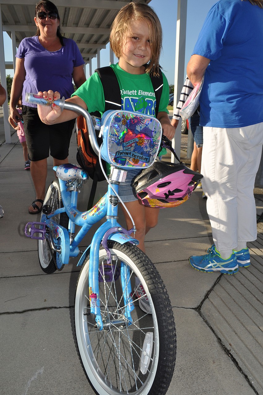 Stephanie Orr, 7, rode her bicycle to Gullett Elementary School for the first day of school.
