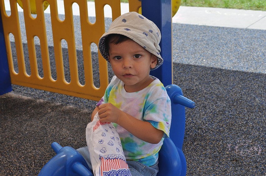 Nick Sharma, 2, ate popcorn.