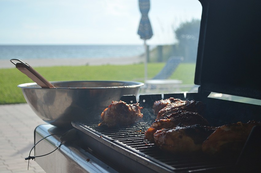 Barbecue chicken was grilled at Christ Churchâ€™s summer social.