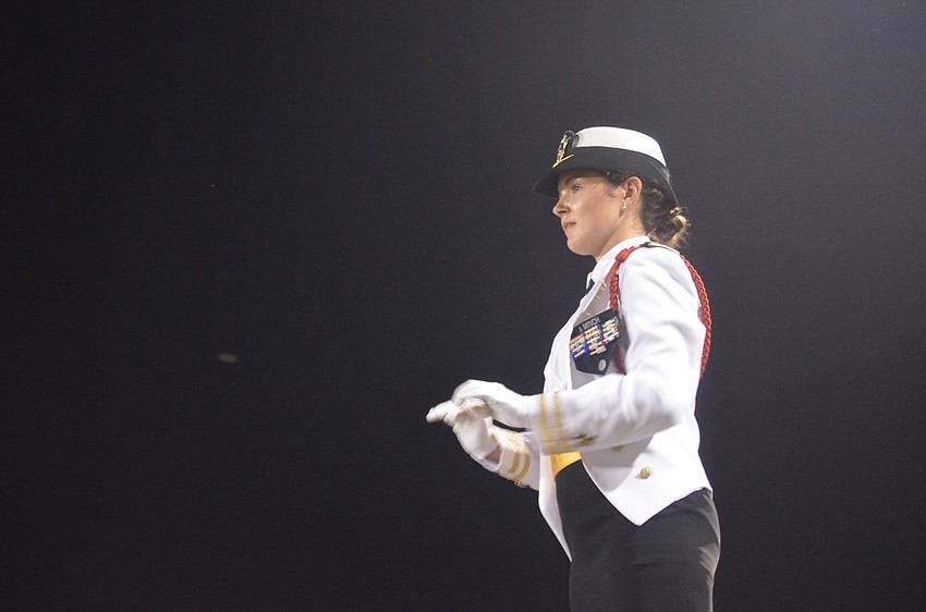 Sarasota High School senior and drum major Audrey Minch leads the drum line during the half time show.