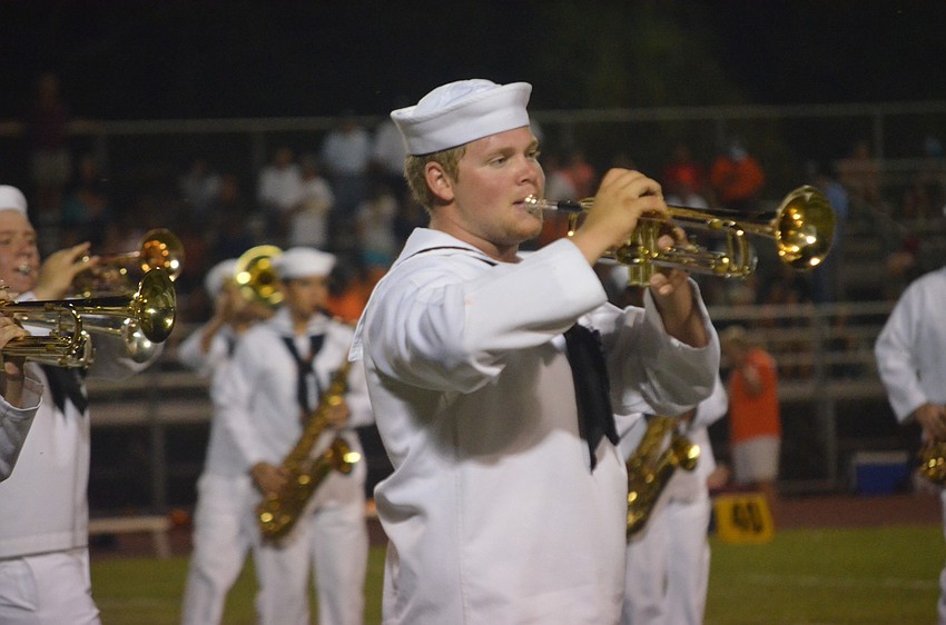 Senior Timmy Labounty plays the trumpet during the half time show.