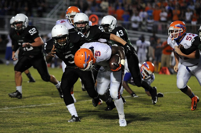 Junior linebacker Wanley Desir wraps up Southeast running back Courtney Allen late in the second quarter.