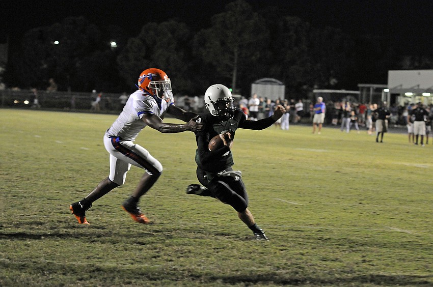 Quarterback Chad Rex scores one of his five rushing touchdowns on the night.