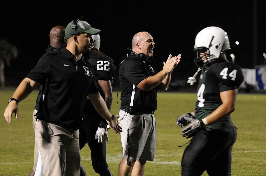 Lakewood Ranch coach Shawn Trent applauds his defense on a goal line stand.