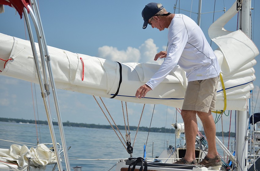 Robert Hindle prepares his boat for the Sarasota Sailing Squadronâ€™s 67th Annual Labor Day Regatta.