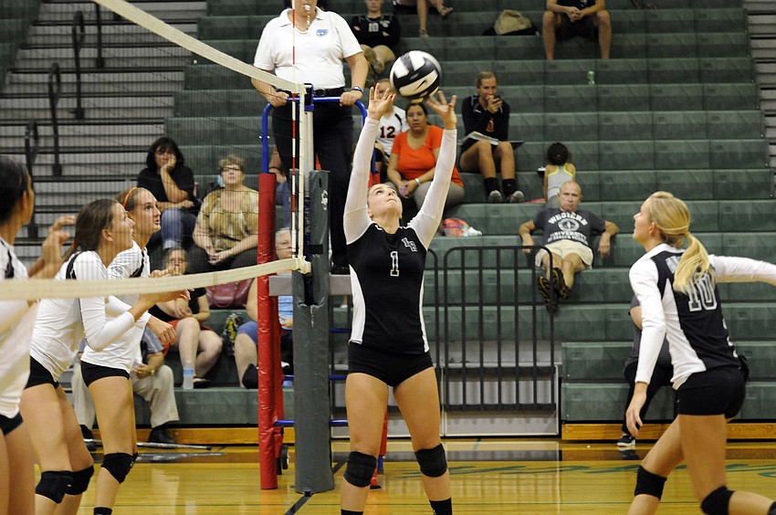 Lakewood Ranch junior Kelley Ainsworth sets the ball back to Coleen Campbell.