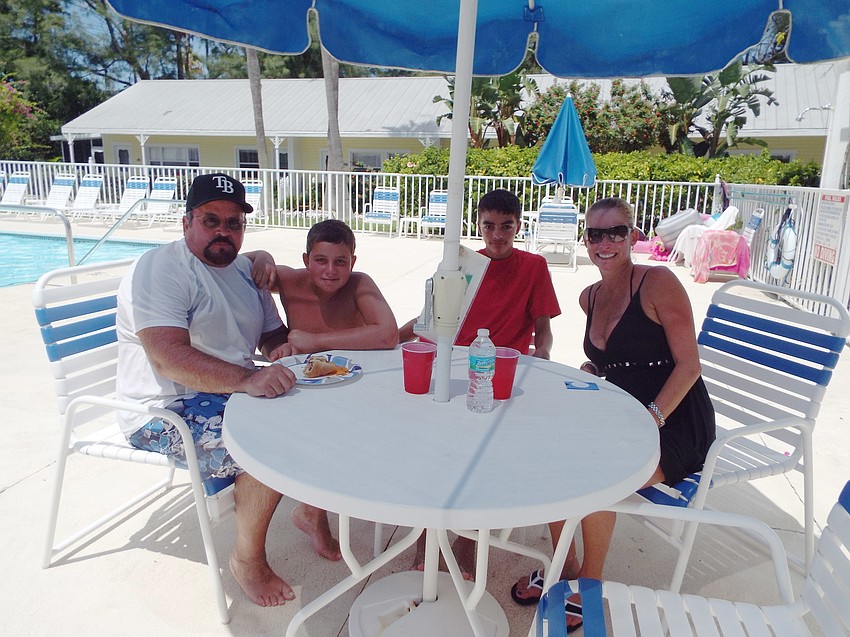 Carlos Curnow and his son Carlos with Austin Padilla and Megan Briggs