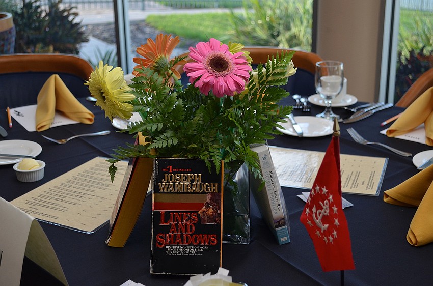The table centerpieces were decorated with mystery books at Bird Key Yacht Clubâ€™s Murder Mystery Dinner Saturday, Sept. 7.
