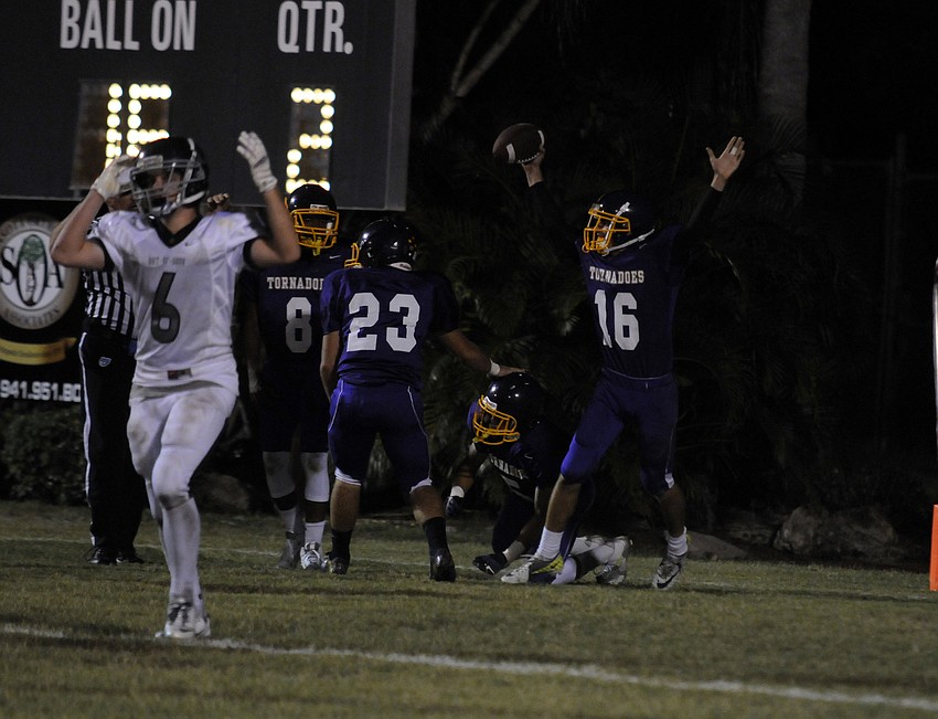 Booker defensive back John Joseph and the Tornadoes defense celebrate after recovering a blocked punt in the end zone in the second quarter.