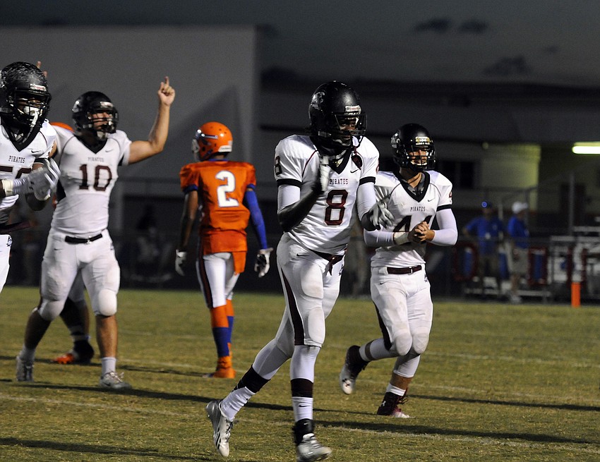 Kelvin Albritton and the Braden River High defense celebrate following a stop on third down.
