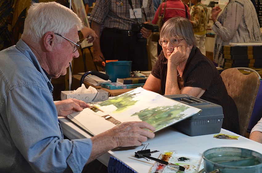 Longboat Key resident Jack Nolan demonstrates watercolor techniques for a captive audience