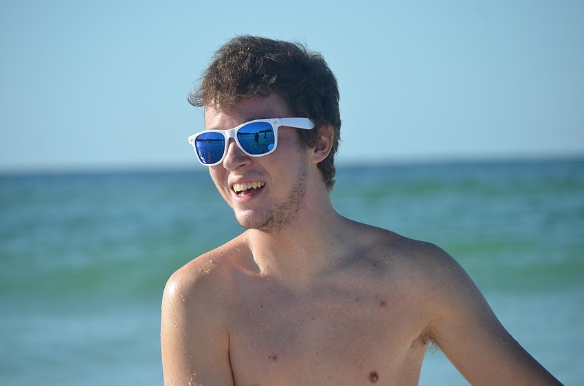 Jimmy Pitts volunteered to help children learn to surf.